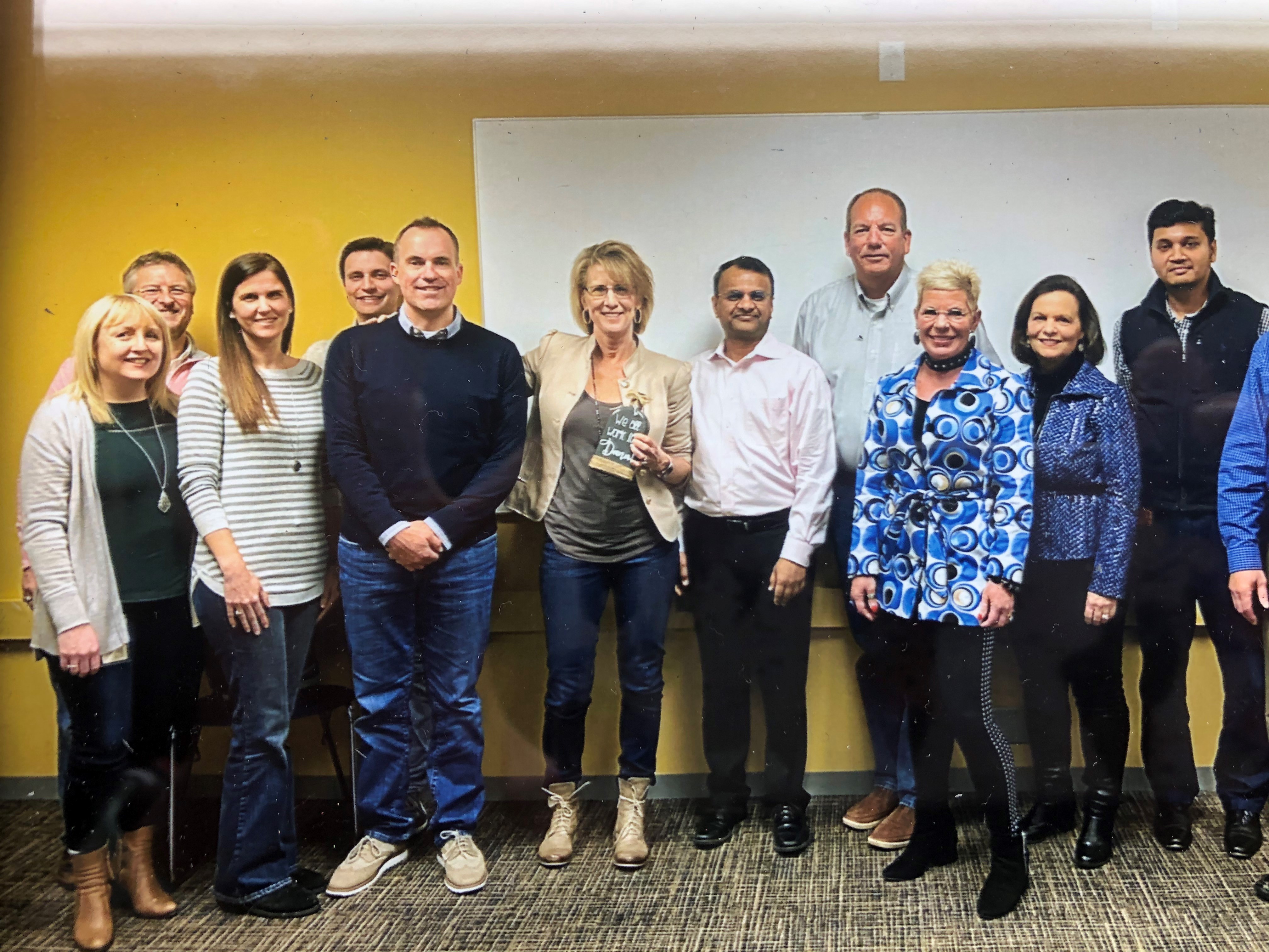 Dana Lorberg, center, Mastercard’s recently-retired technology advisor, with her team.