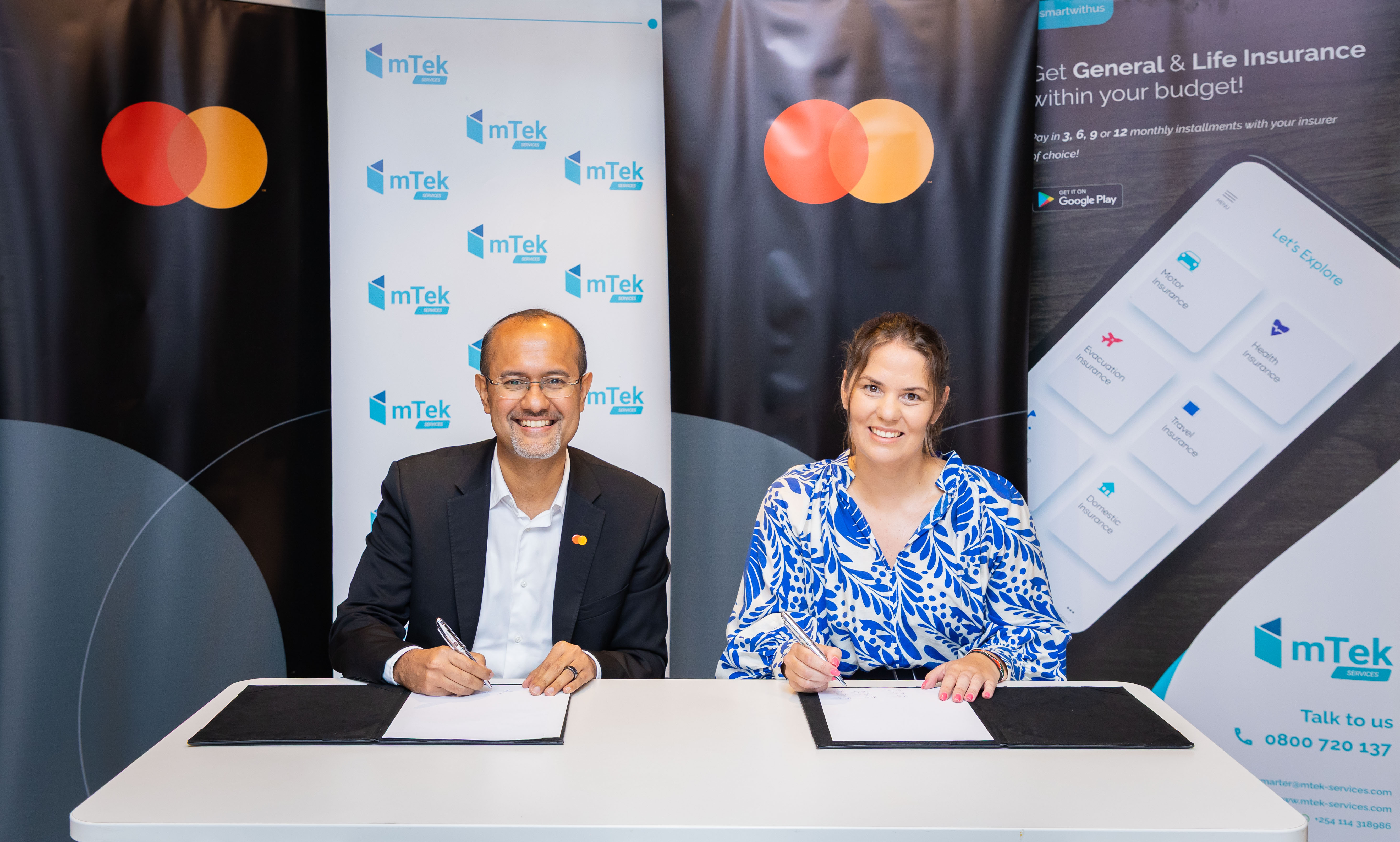 Shehryar Ali, SVP and Country Manager for East Africa & Indian Ocean Islands at Mastercard (left) and Bente Krogmann, CEO of Hillcroft Holdings sign strategic partnership that will integrate insurance solutions directly into consumer and SME card experiences across East Africa.