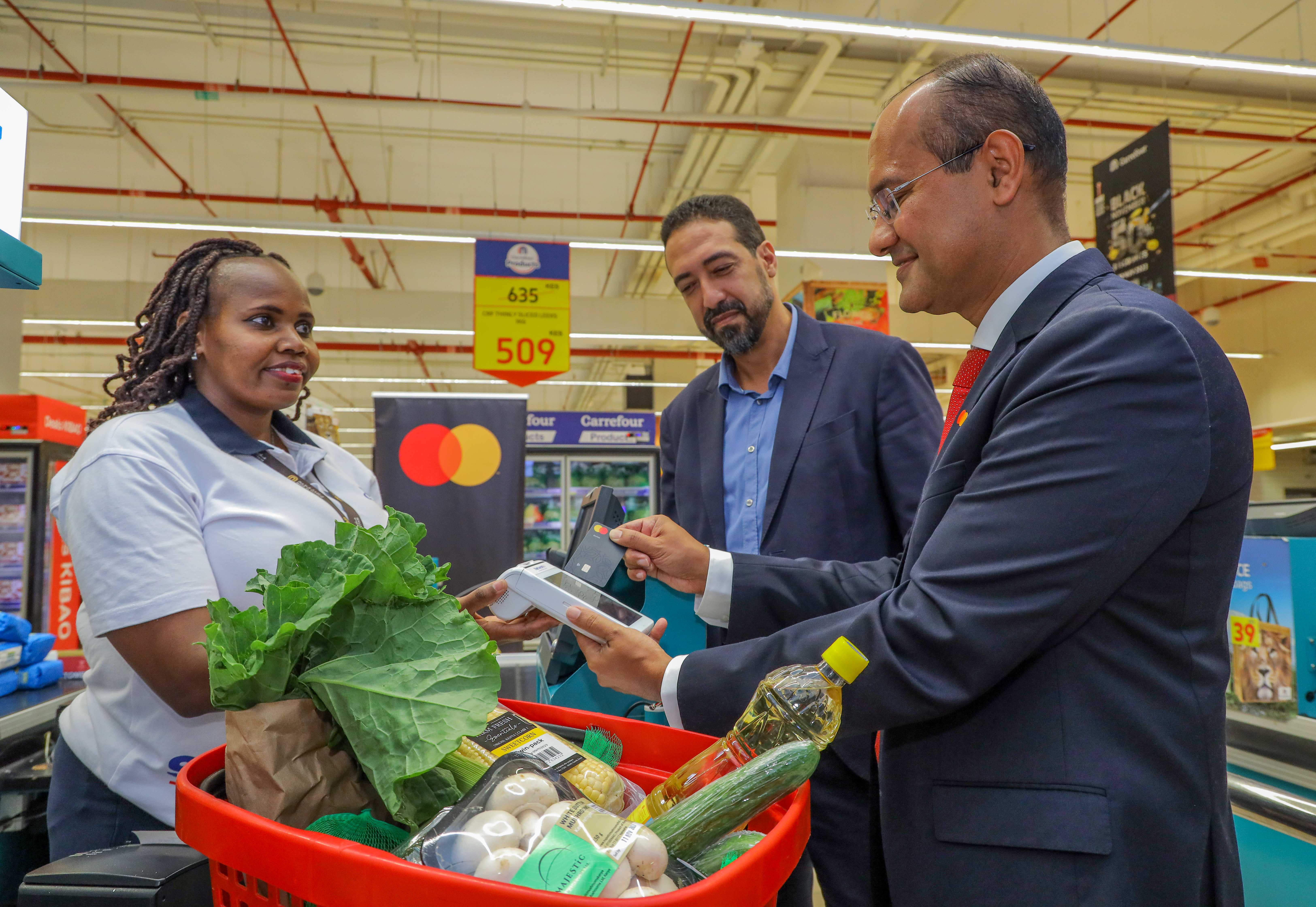 Rachid Nouri, Carrefour East Africa Regional Director for Finance, Majid Al Futtaim (centre) and Shehryar Ali, Senior Vice President and Country Manager for East Africa and Indian Ocean Islands, Mastercard (right) launch their festive season campaign offering a 20% discount for Mastercard users at Carrefour.