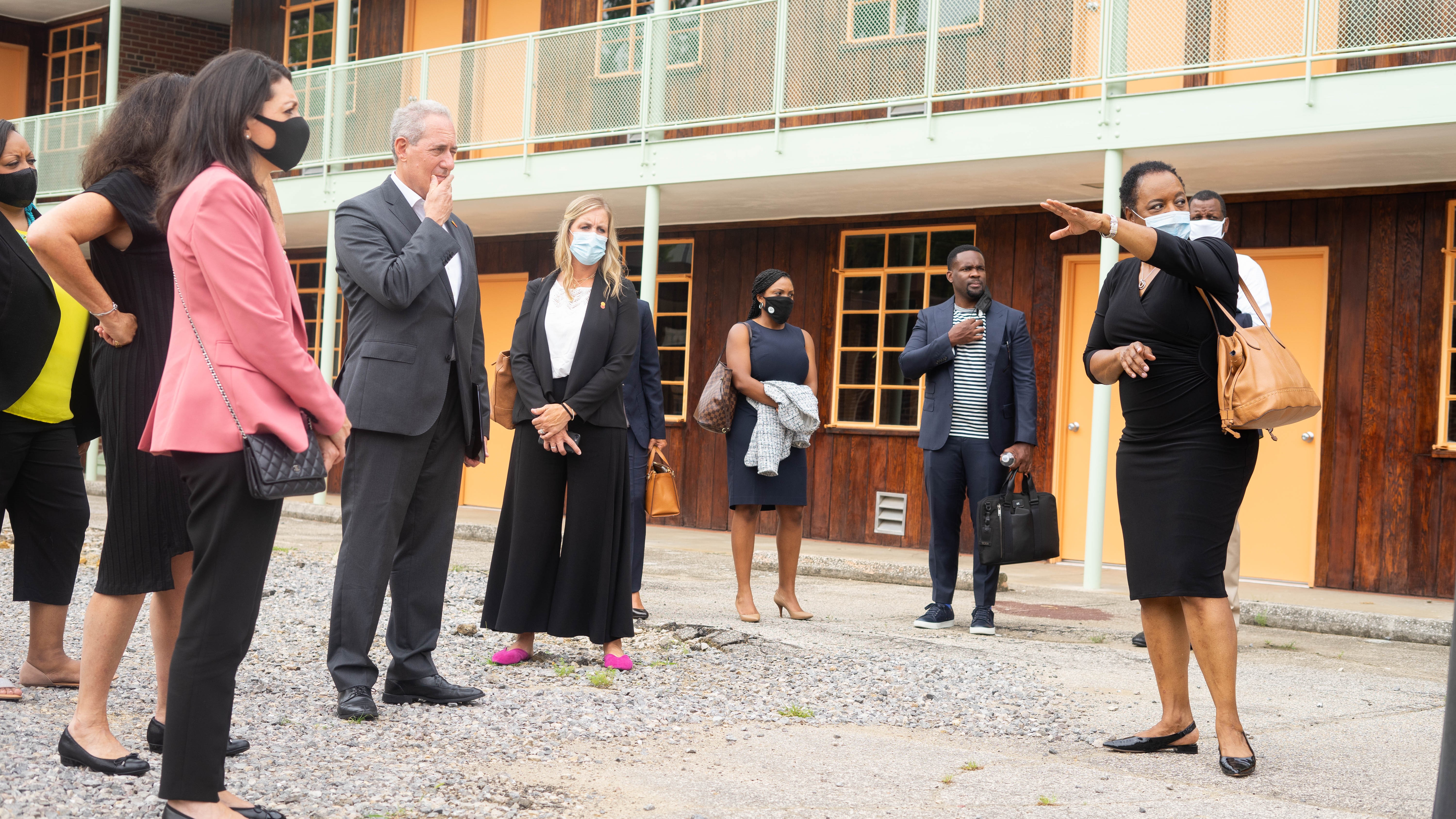 Denise Gilmore, right, shares the history of the Gaston Motel and the plans for its future with local leaders and Mastercard executives in early August. (Photo courtesy of Mastercard)
