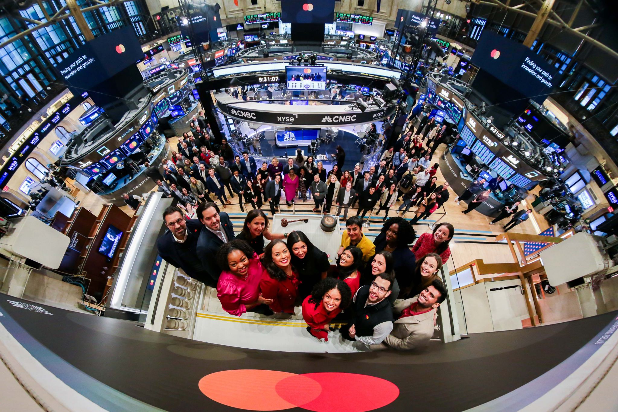 Mastercard Start Path leaders and other employees ring the bell at the New York Stock Exchange.