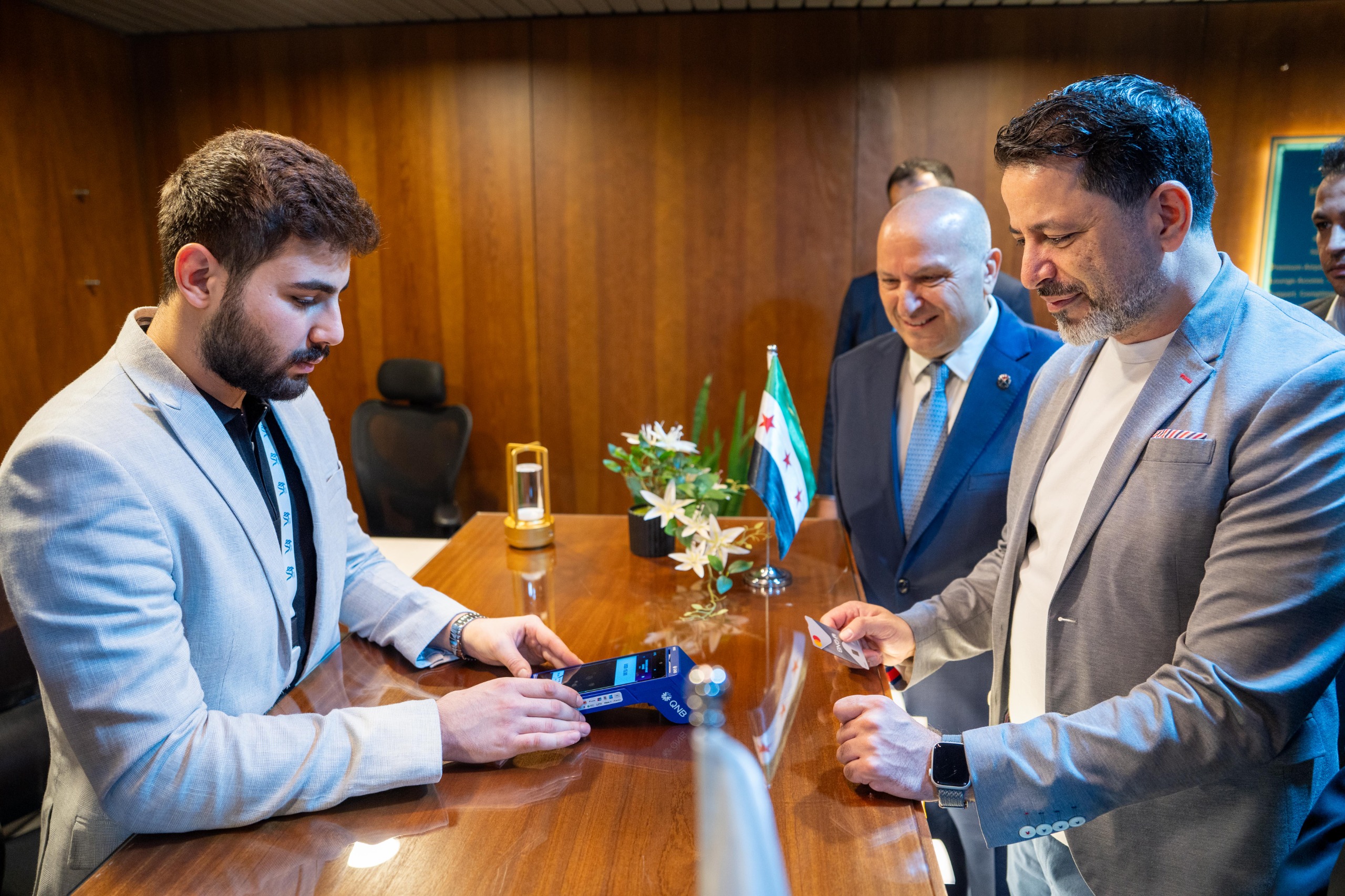 Governor of the Central Bank of Syria, HE, Mohammed Safwat Raslan conducts the first international card transaction using a Mastercard card, marking a significant milestone in reconnecting Syria to the global payments network.