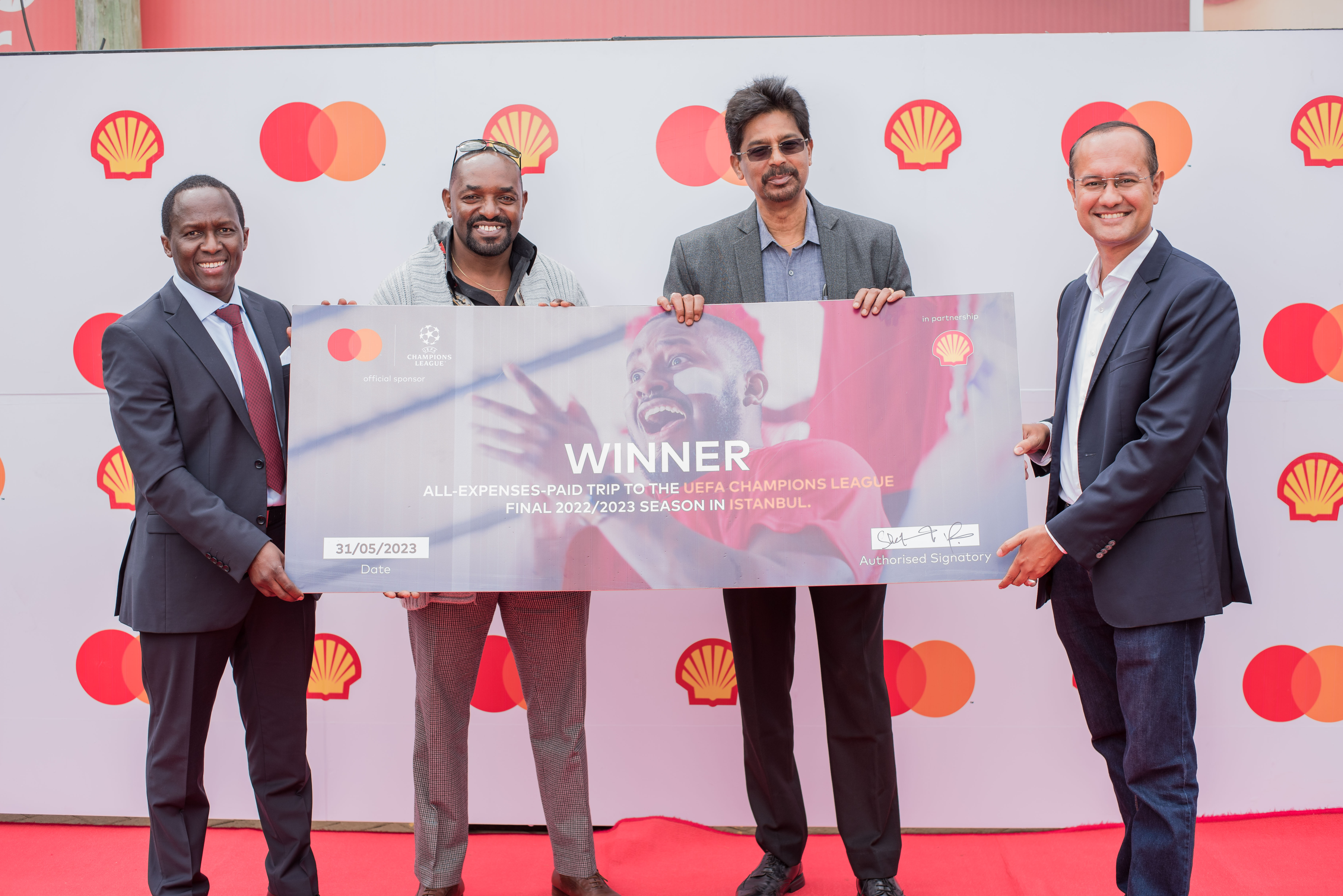 Photo caption: Peter Murungi, Managing Director of Vivo Energy Kenya (Left) and Shehryar Ali, Country Manager for East Africa at Mastercard (Right) with the two lucky winners Raymond Nyambisa (Centre Left) and Jaison Jose (Centre Right). The two have won an all-expenses paid trip to watch the UEFA Champions League Finals in Istanbul, Turkey following a month-long campaign by Mastercard and Vivo Energy.