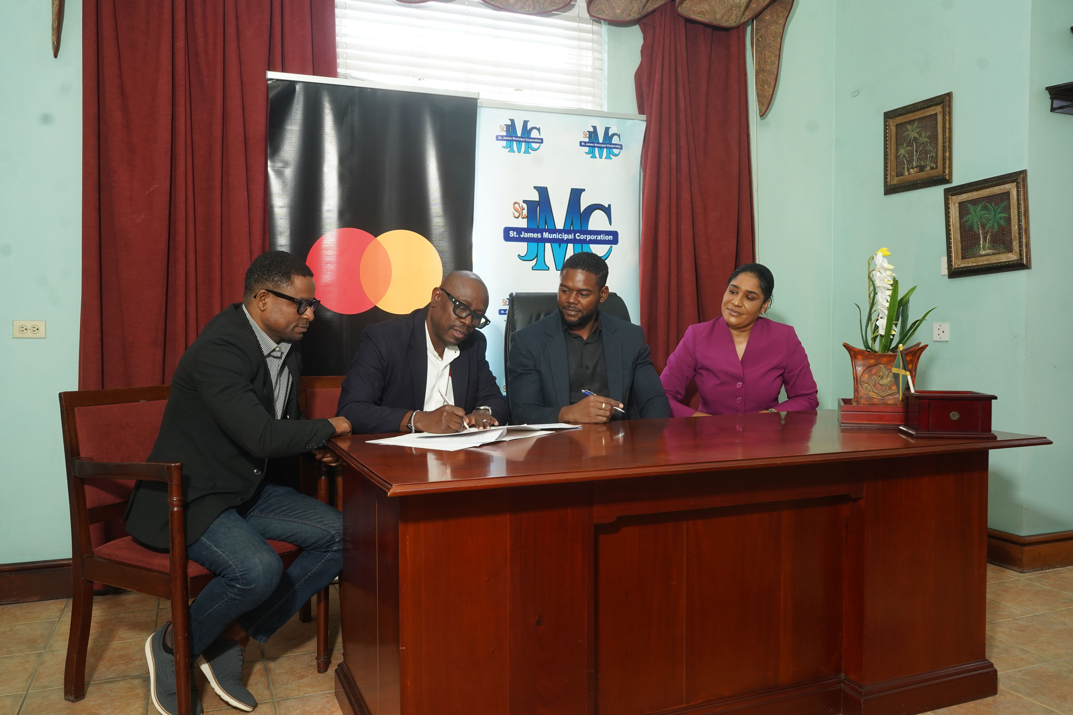 From left to right, Carl Gordon (Director of Government and Strategic Growth, Mastercard English Caribbean), Dalton Fowles (Country Manager for Jamaica, Mastercard), His Worship The Mayor of Montego Bay Richard Vernon, and Naudia Crosskill (Chief Executive Officer, St. James Municipal Corporation).
