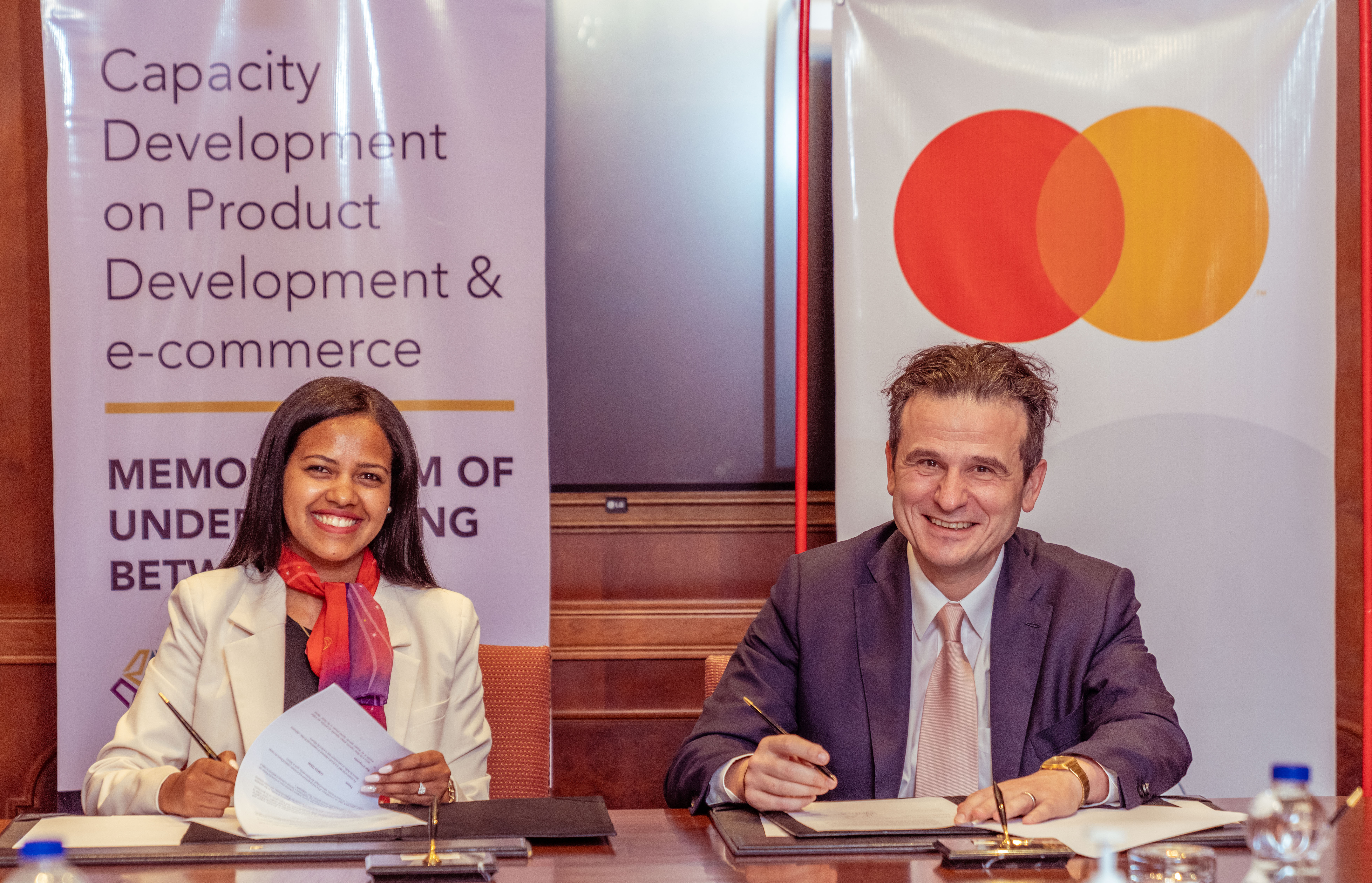 (L-R) Rahel Getachew, Chief Executive Officer, Ethiopian Minerals Petroleum and Biofuel Corporation (EMPBC) and Dimitrios Dosis, President of Eastern Europe, Middle East and Africa, Mastercard, signing the partnership agreement aimed at digitizing EMPBC’s mineral e-commerce platform through Mastercard’s Payment Gateway Service (MPGS).