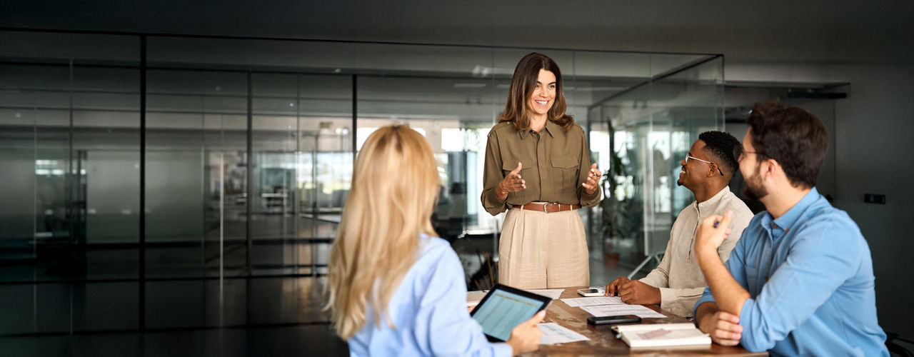 Two happy business colleagues at meeting in modern office