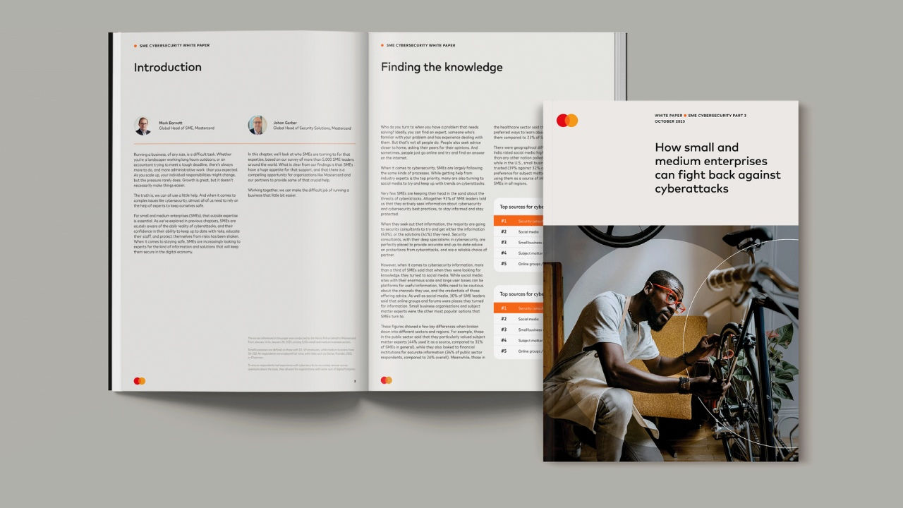 White paper cover and opened to a page. 