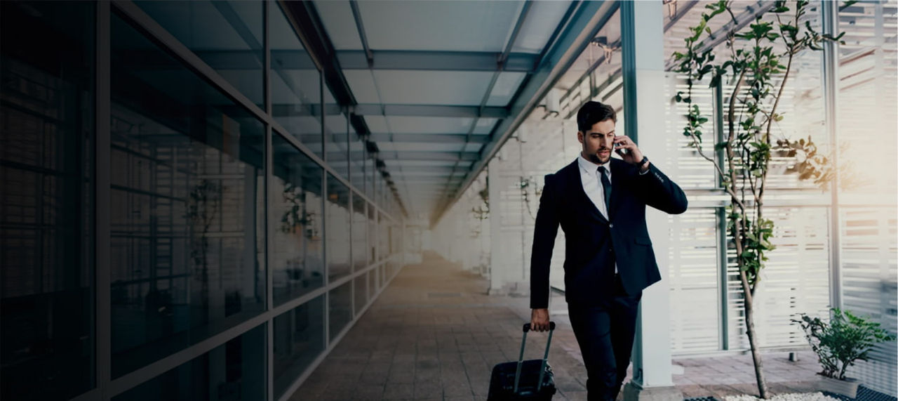 man walk with suitcase in airport