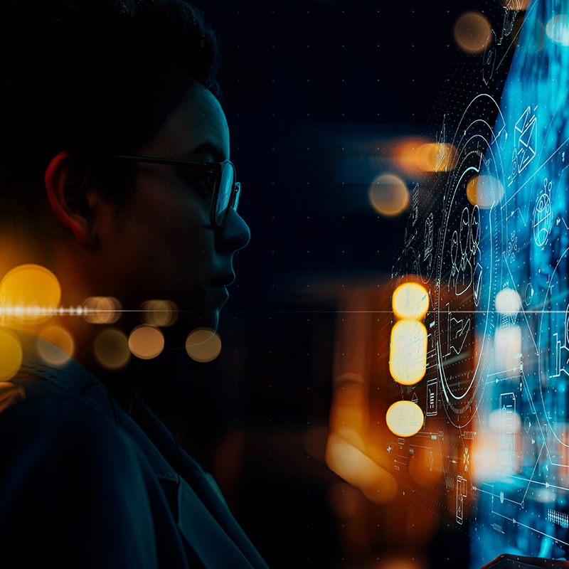 Person looking at data across a dark background