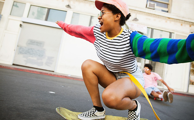 young woman skateboarding.
