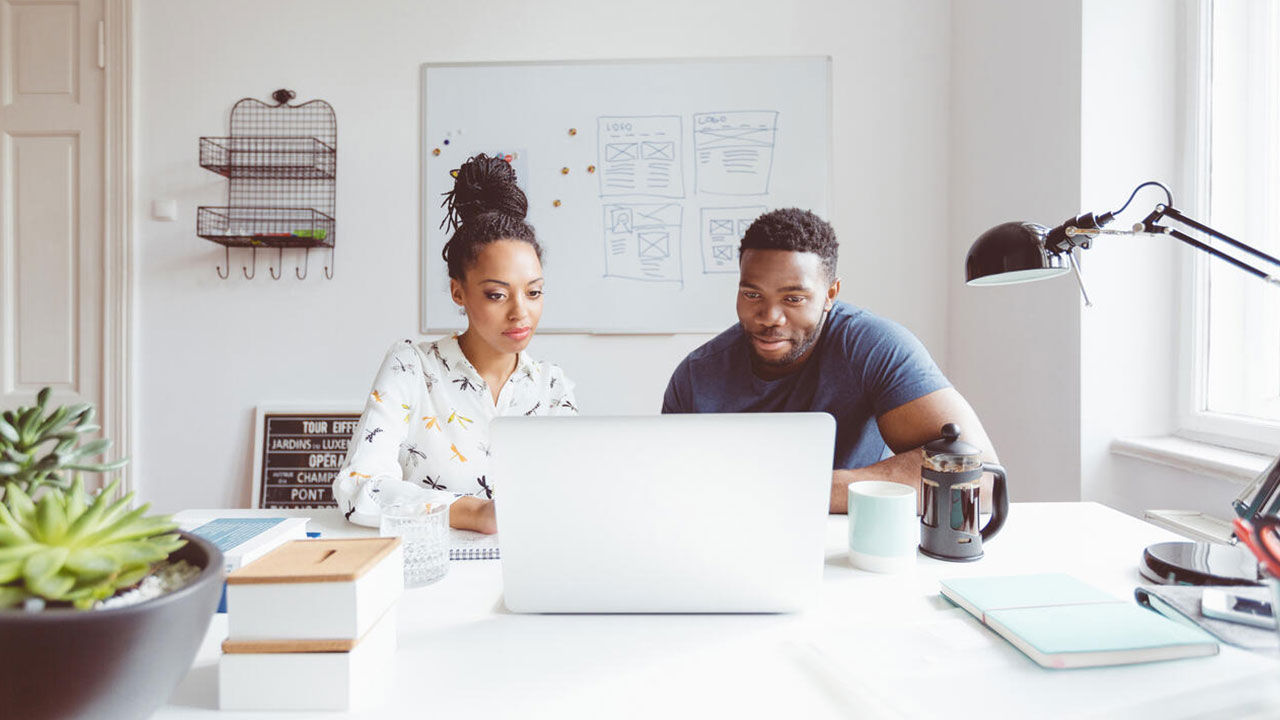 Woman and man working together in the start up agency.