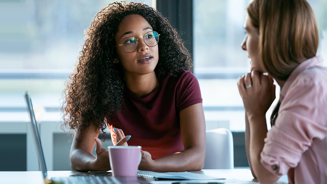 Business women working together in an office.