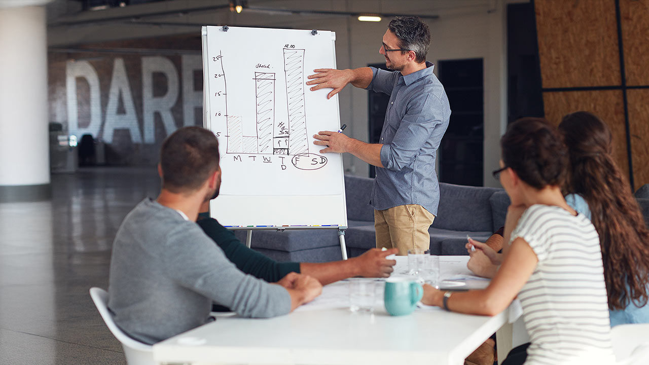 Seminar whiteboard and man in office for workshop.