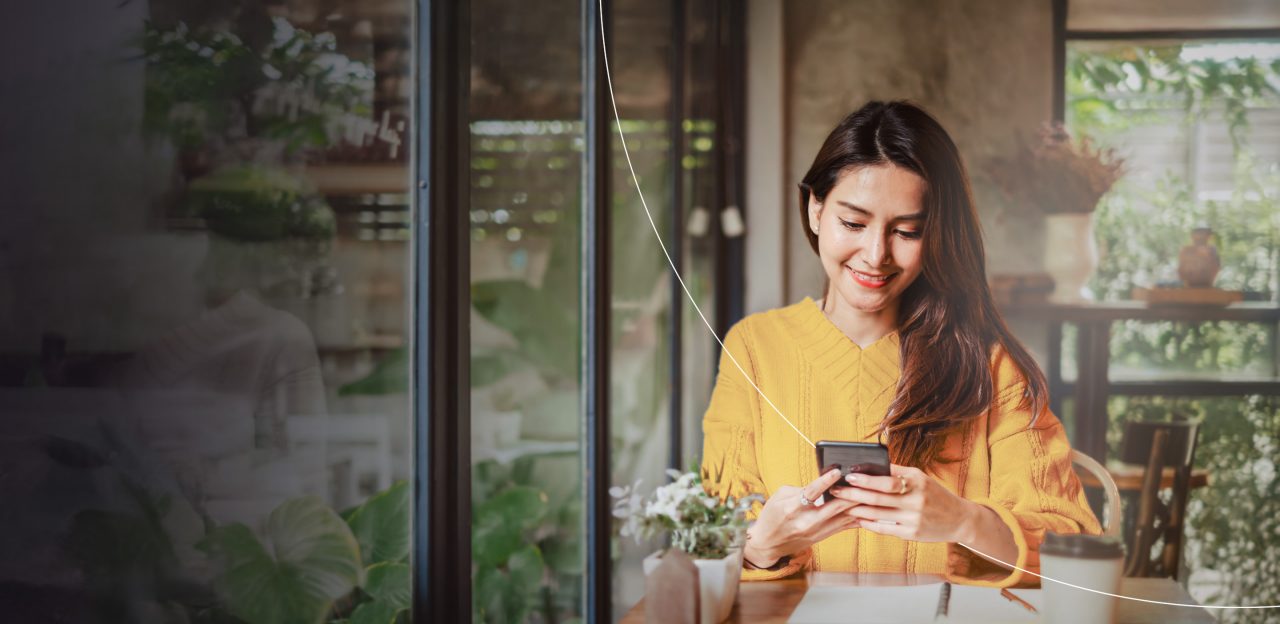 Woman paying with phone.