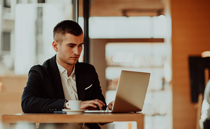 Office employee using laptop.