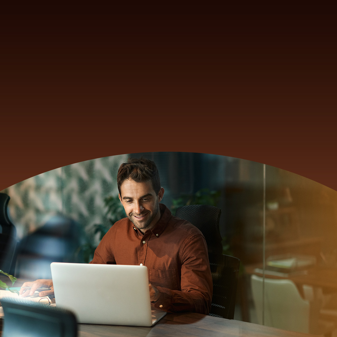Businessman working on laptop.