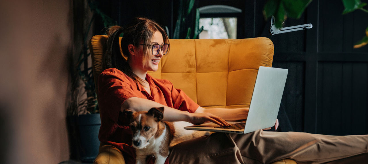 Woman on her laptop smiling