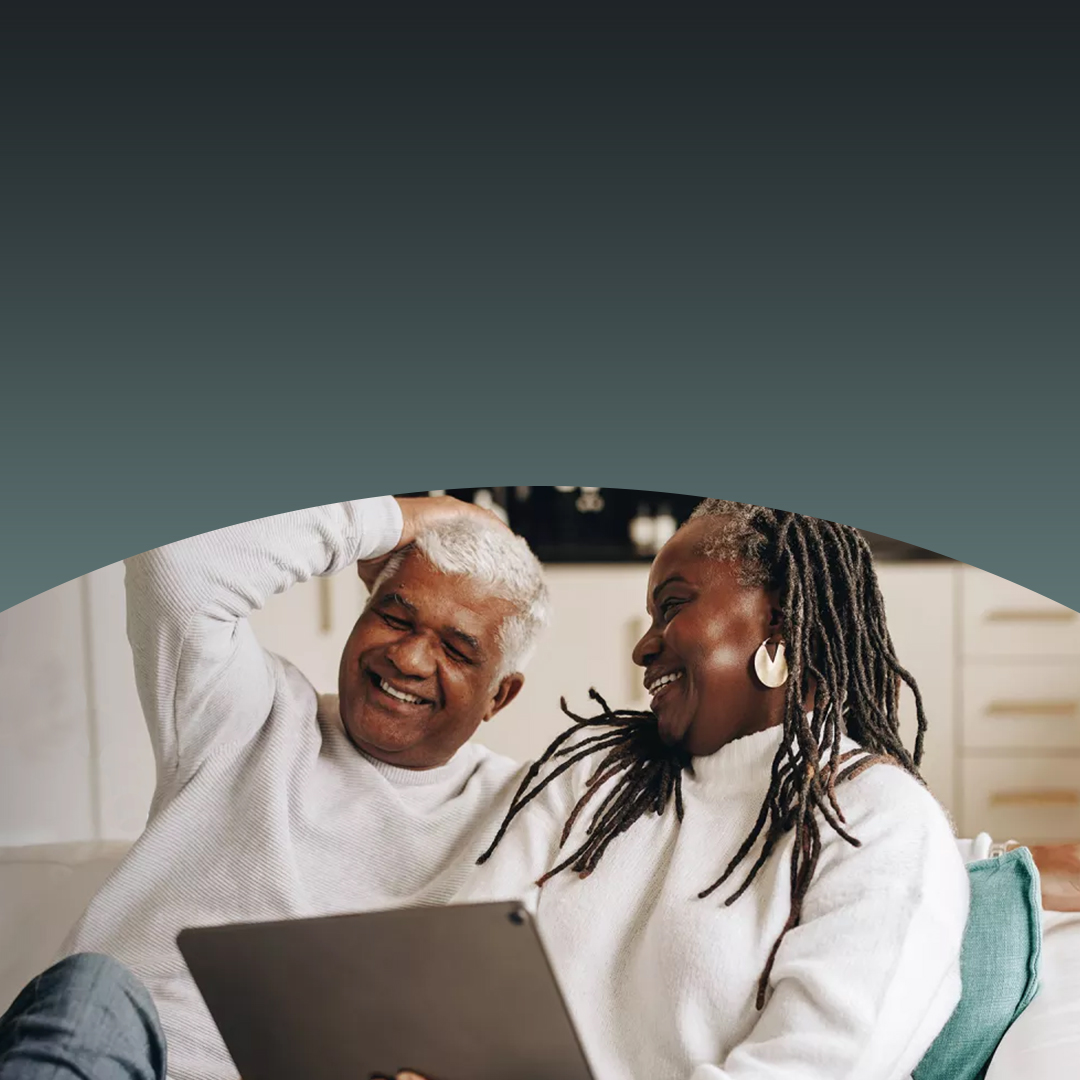 Couple looking at each other and laughing.