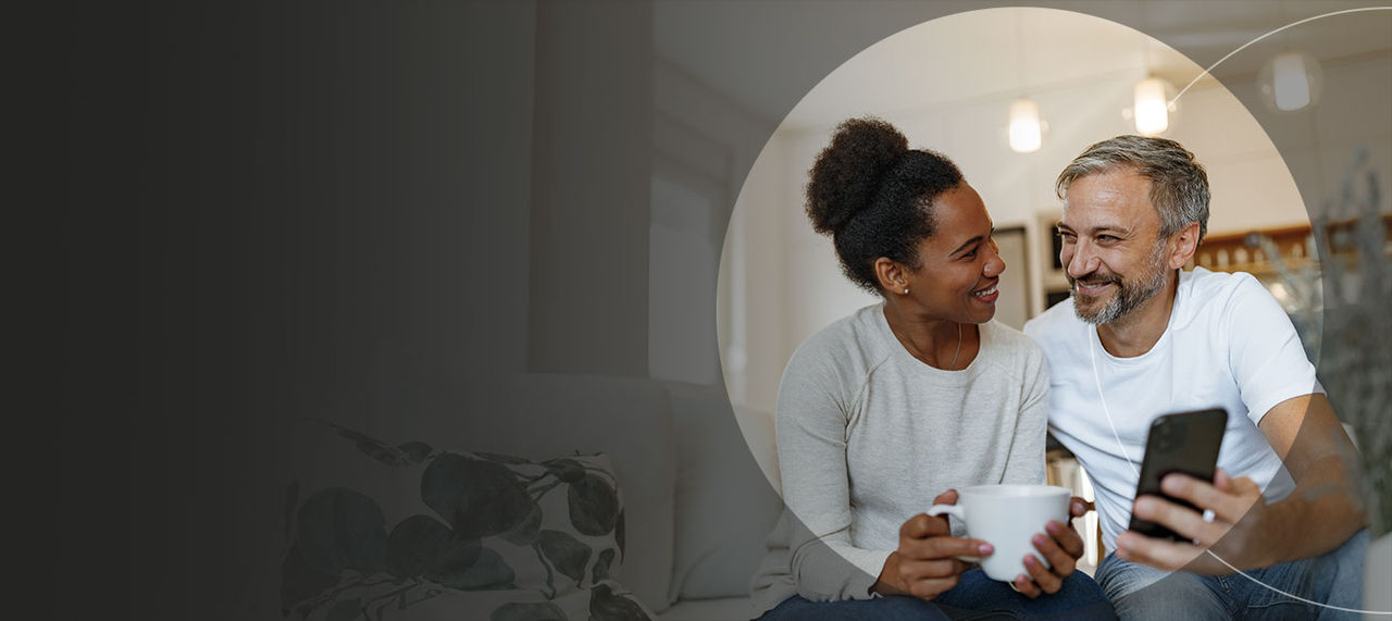 Two people looking at phone.